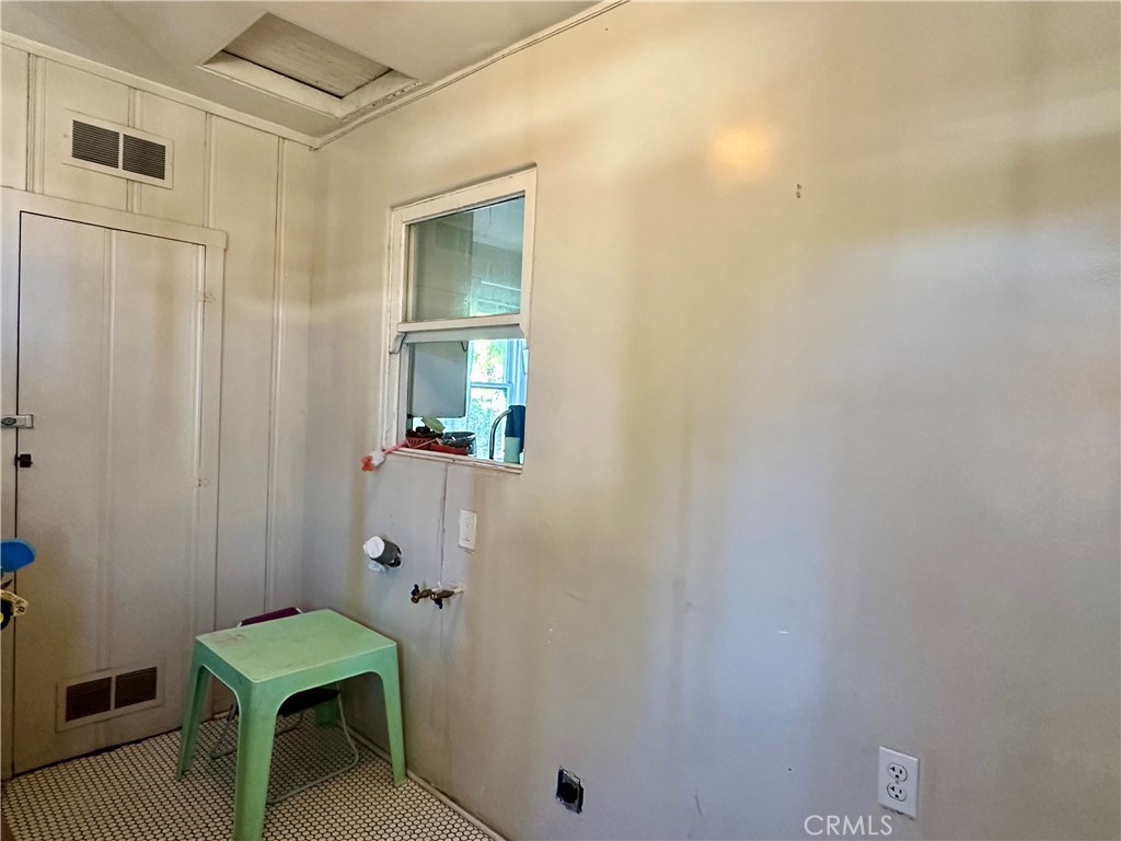 4308 Lime Street Riverside, CA 92501 - Photo 7 of 14 a bathroom with a mirror and a shower