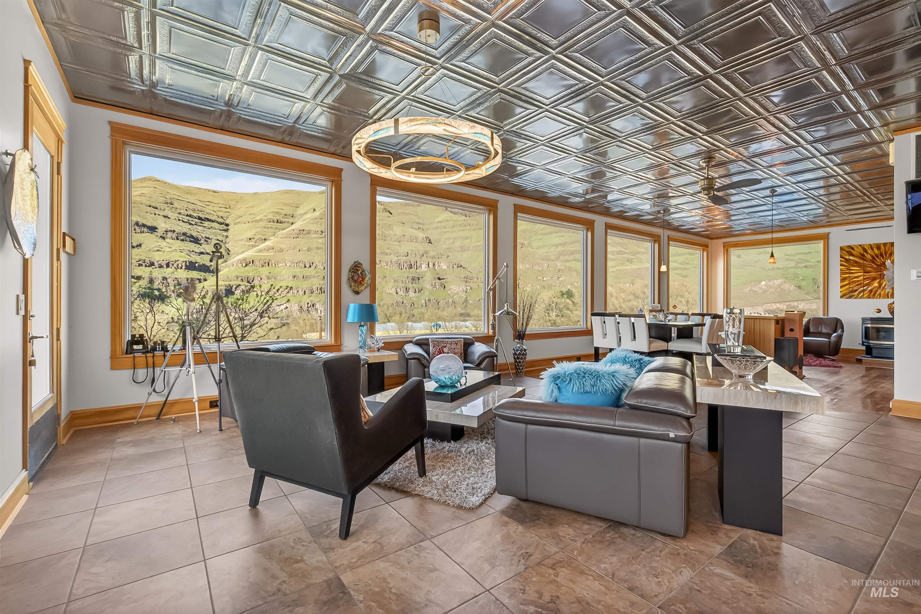 6382 Snake River Road Asotin, WA 99402 - Photo 14 of 34 Living room with an ornate ceiling and baseboards