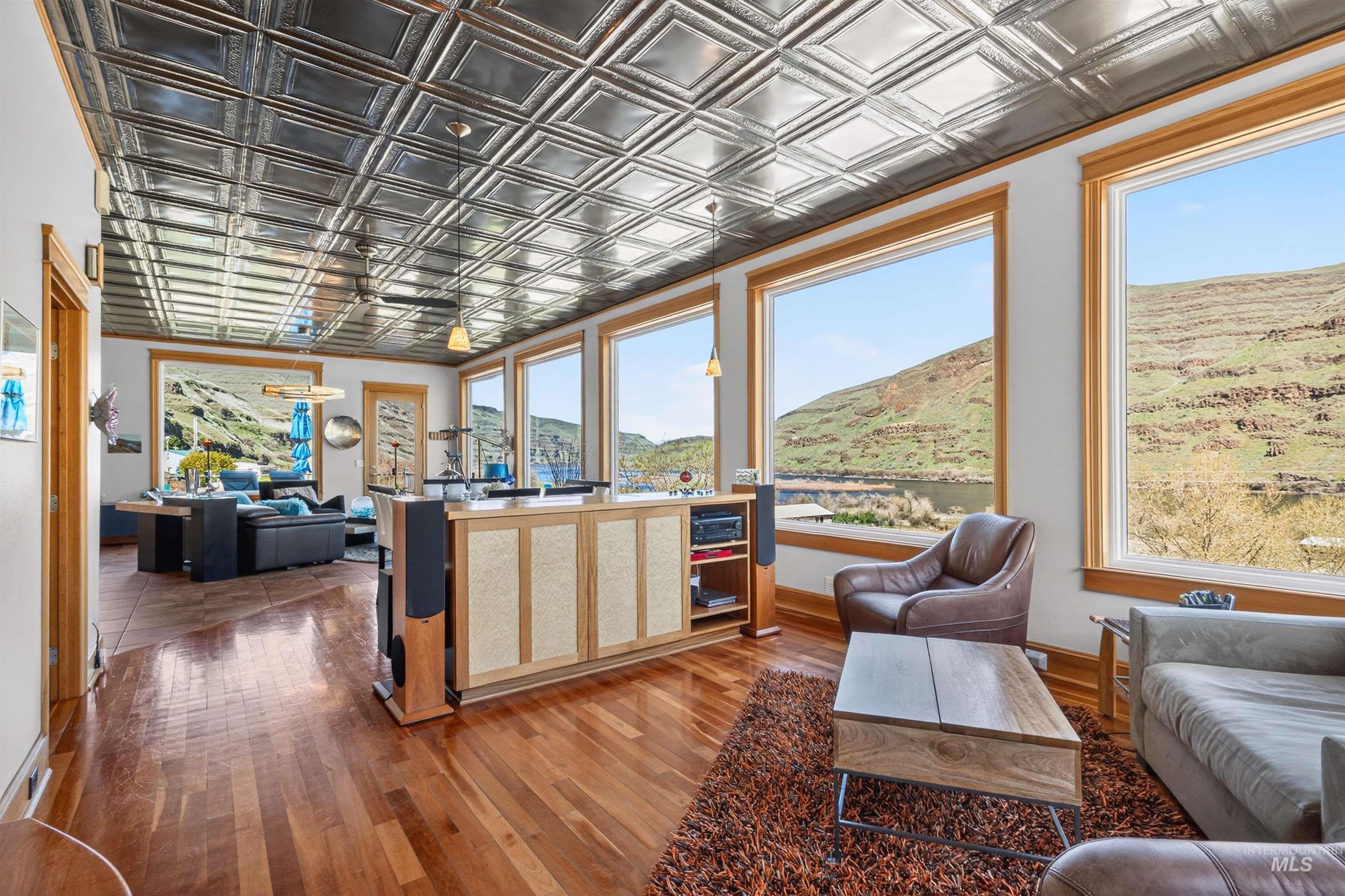 6382 Snake River Road Asotin, WA 99402 - Photo 15 of 34 Living room featuring an ornate ceiling, wood finished floors, and a mountain view