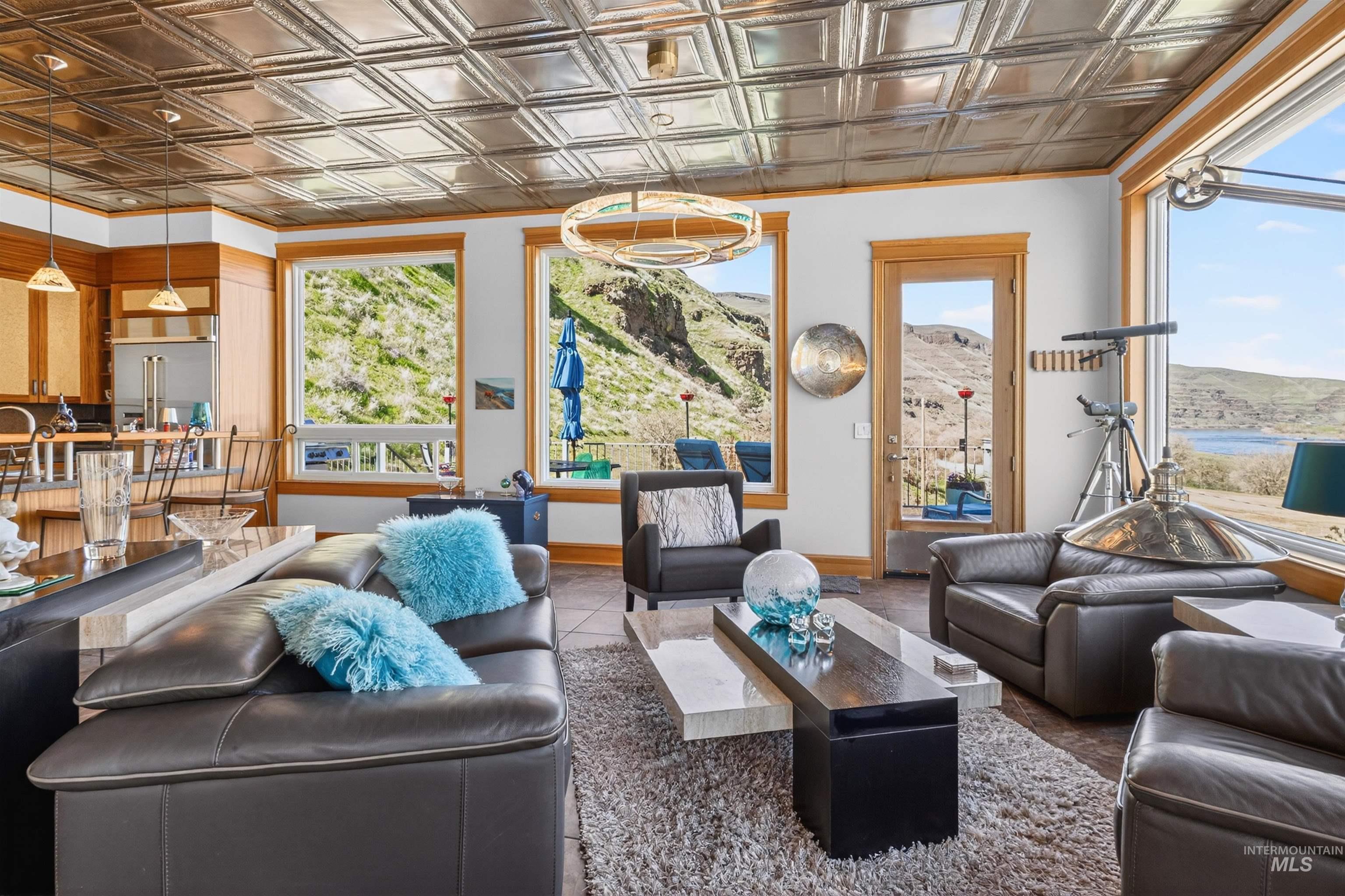 6382 Snake River Road Asotin, WA 99402 - Photo 22 of 34 Living area featuring an ornate ceiling and baseboards