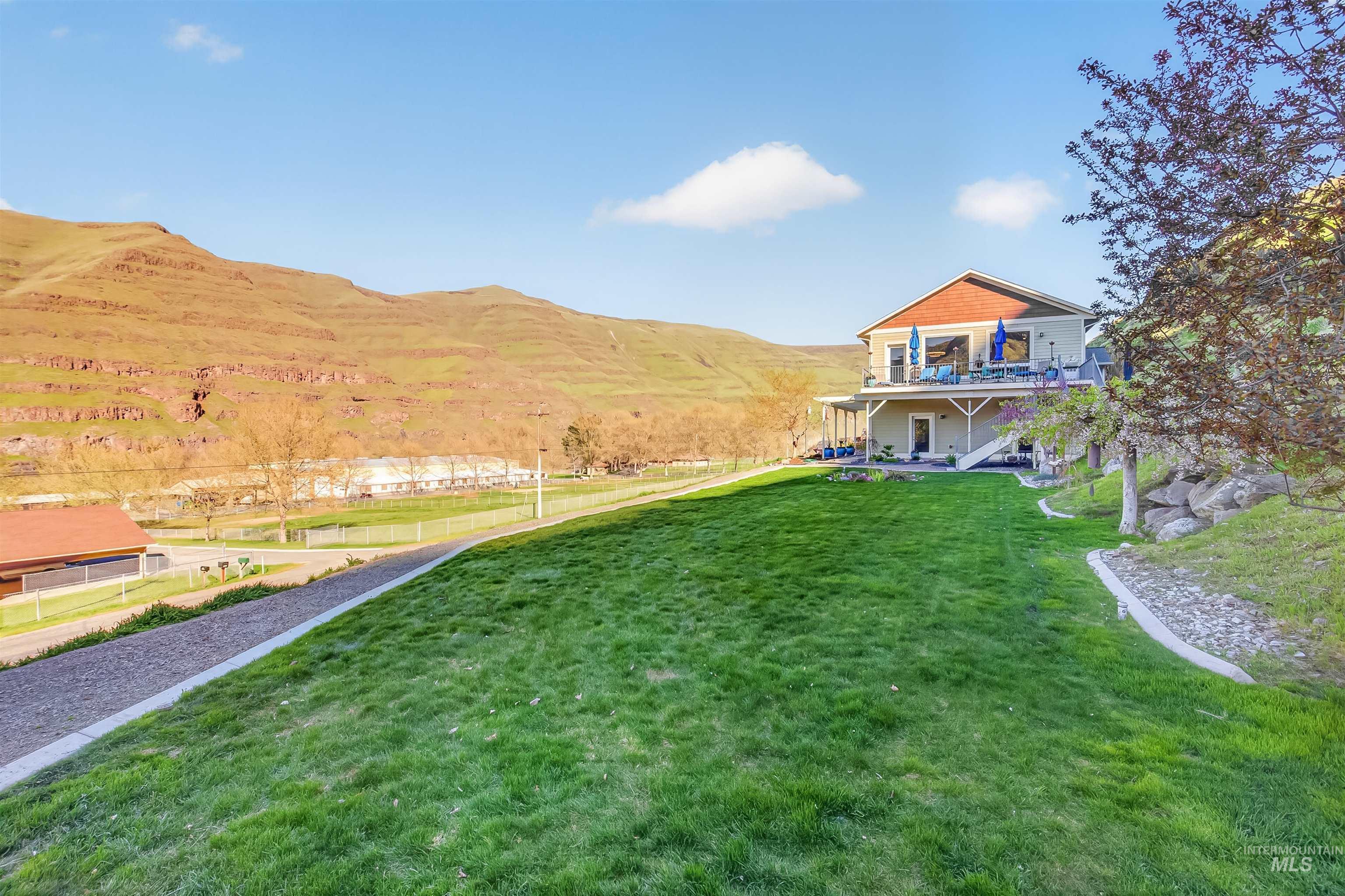 6382 Snake River Road Asotin, WA 99402 - Photo 32 of 34 View of green lawn with a mountain view