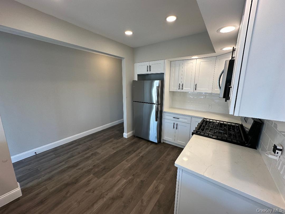 84 Rochester Avenue, Unit MAIN Long Beach, NY 11561 - Photo 14 of 27 a kitchen with a refrigerator and a sink