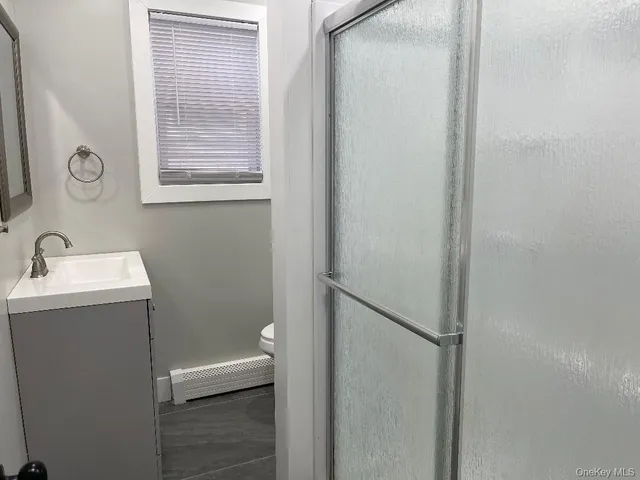 a bathroom with a sink toilet and vanity