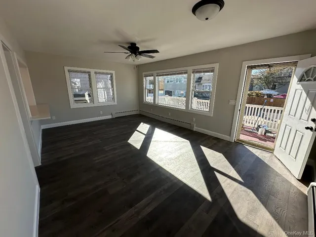 a view of entryway with wooden floor