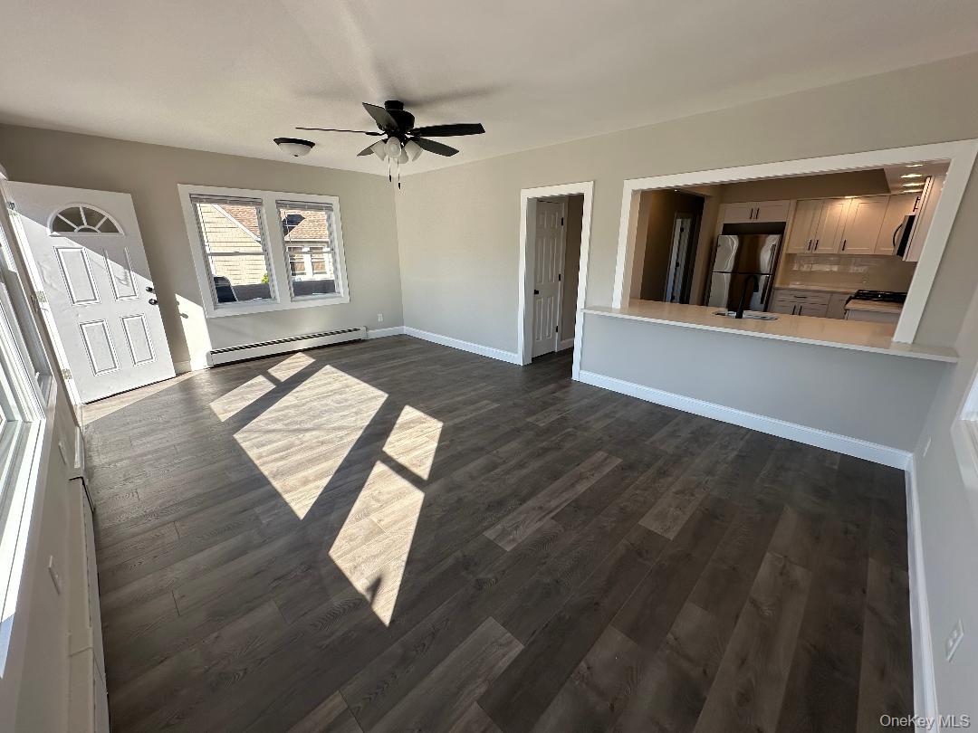 84 Rochester Avenue, Unit MAIN Long Beach, NY 11561 - Photo 7 of 27 a view of an entryway with wooden floor
