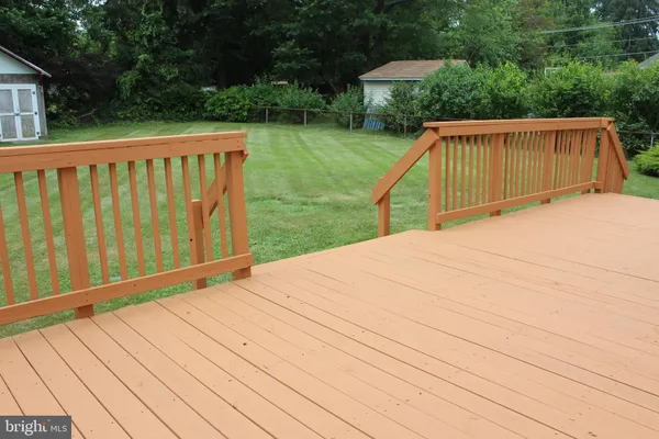 a view of balcony with wooden floor and outdoor space