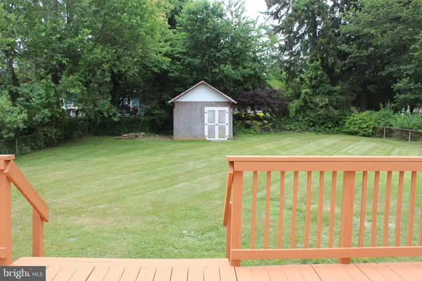 a view of backyard with green space