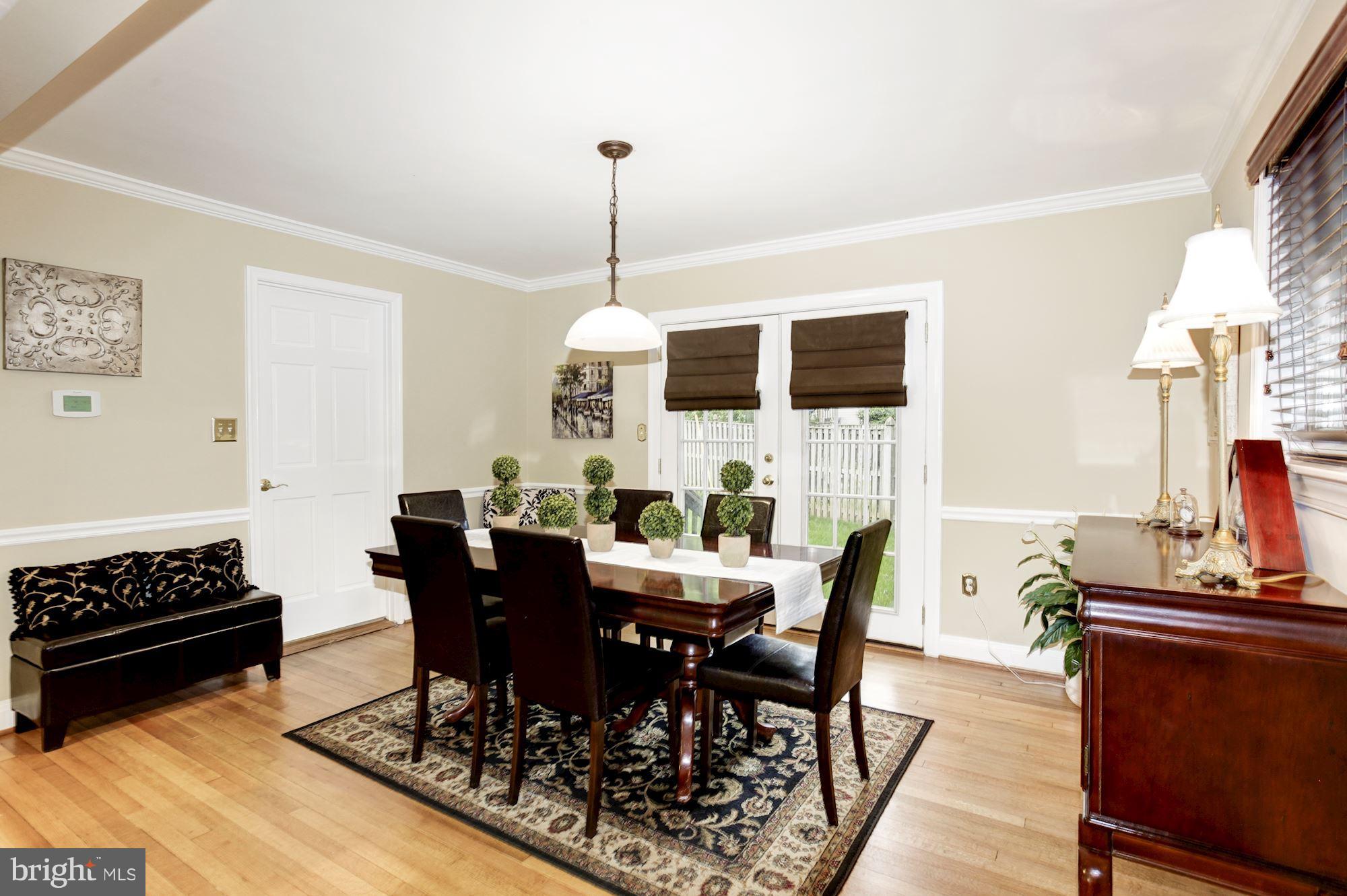 2819 South Arlington Ridge Road Arlington, VA 22202 - Photo 12 of 30 a view of a dining room with furniture and wooden floor