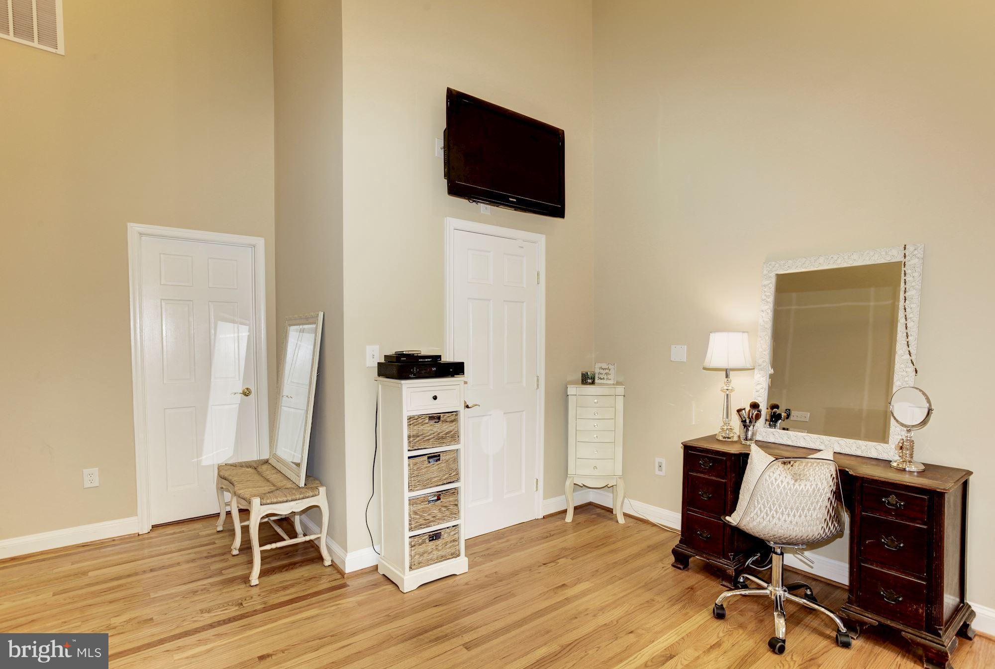 2819 South Arlington Ridge Road Arlington, VA 22202 - Photo 17 of 30 a view of a workspace with furniture and wooden floor