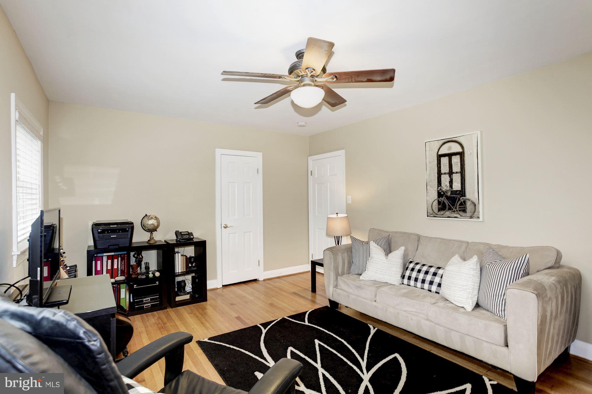 2819 South Arlington Ridge Road Arlington, VA 22202 - Photo 21 of 30 a living room with furniture and wooden floor