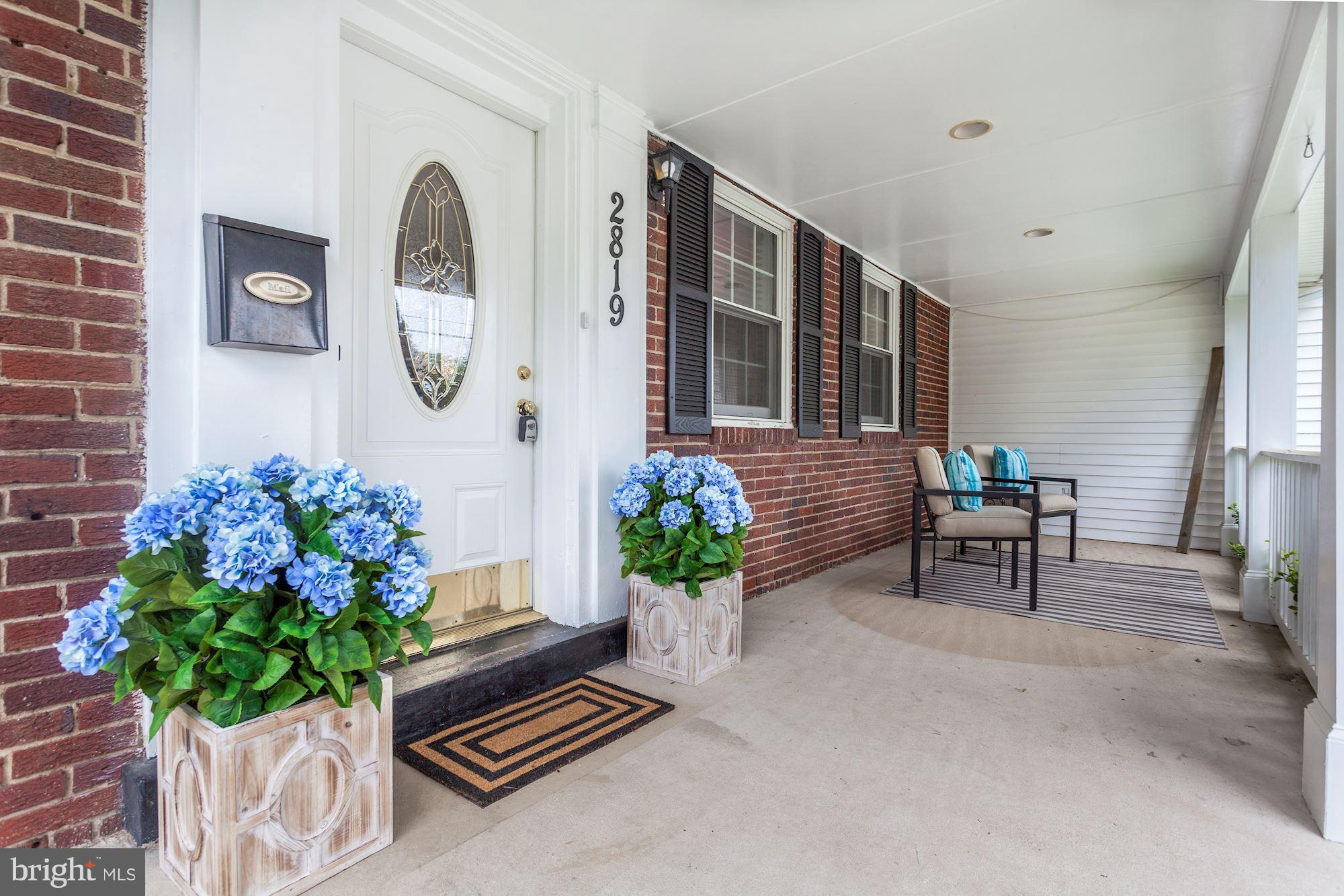 2819 South Arlington Ridge Road Arlington, VA 22202 - Photo 29 of 30 a living room with furniture and a potted plant