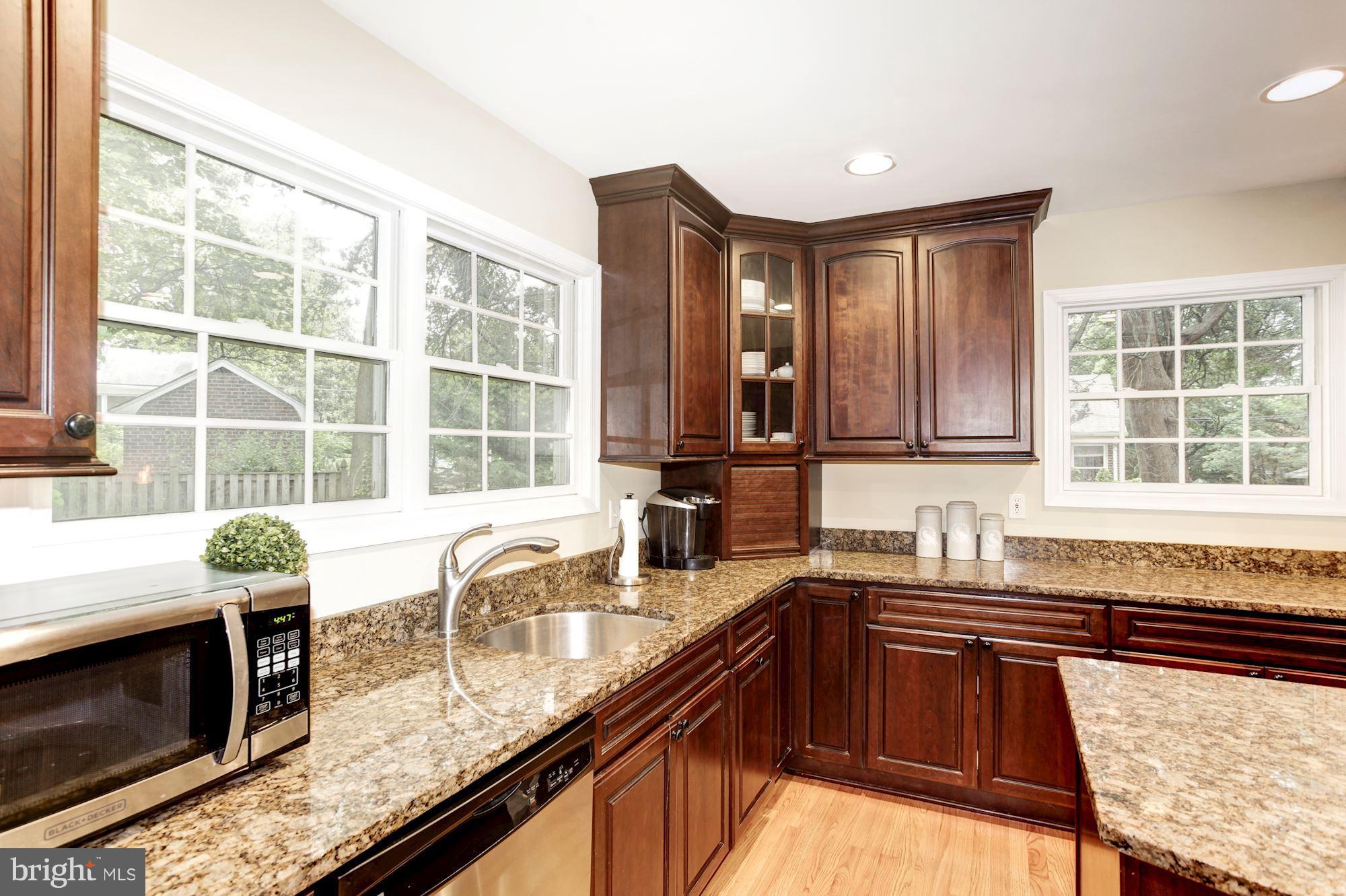 2819 South Arlington Ridge Road Arlington, VA 22202 - Photo 6 of 30 a kitchen with granite countertop a sink and a stove
