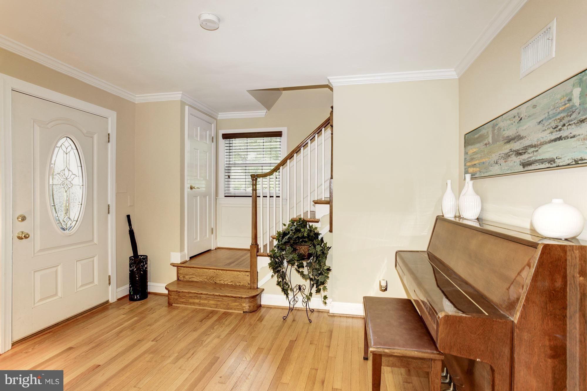 2819 South Arlington Ridge Road Arlington, VA 22202 - Photo 8 of 30 a living room with furniture and wooden floor