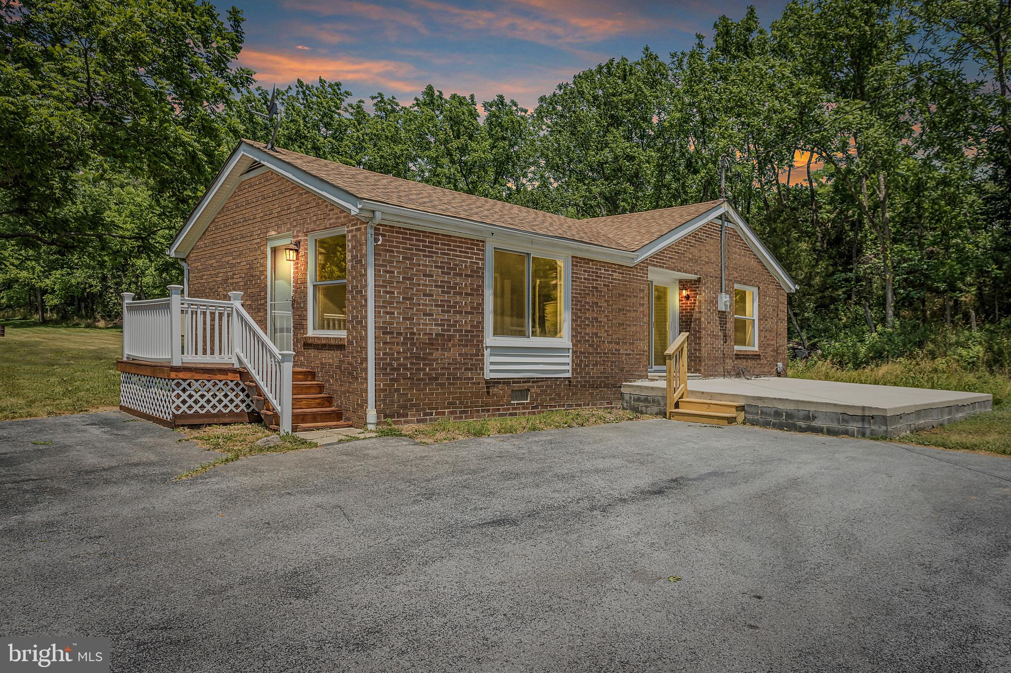 3260 Front Royal Pike White Post, VA 22663 - Photo 1 of 49 a view of a house with a yard and large tree