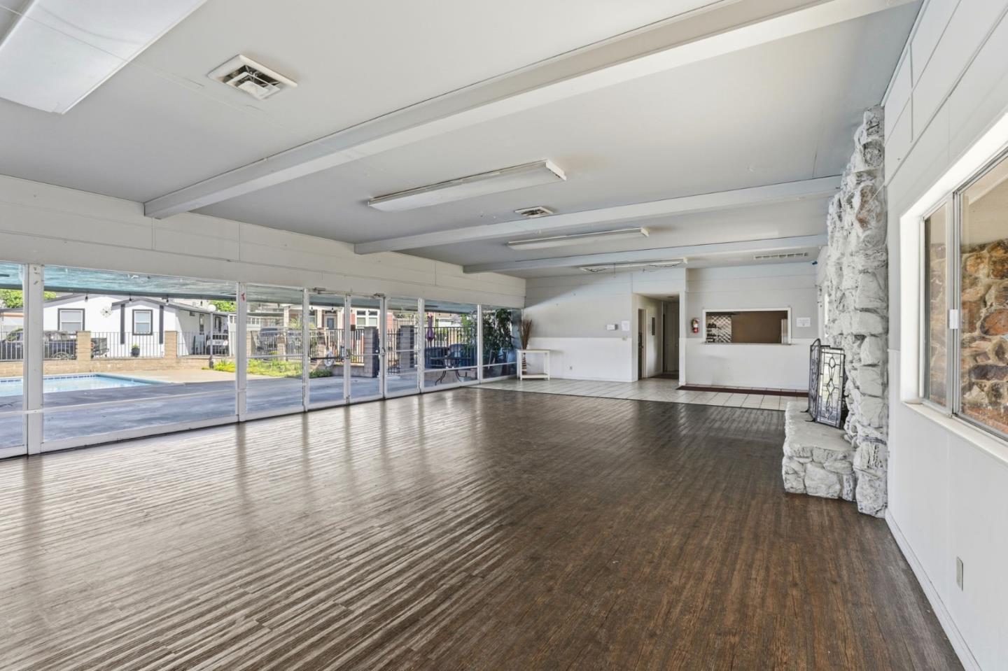 20 Russell Road, Unit 8 Salinas, CA 93906 - Photo 33 of 38 a view of an empty room with wooden floor and a window
