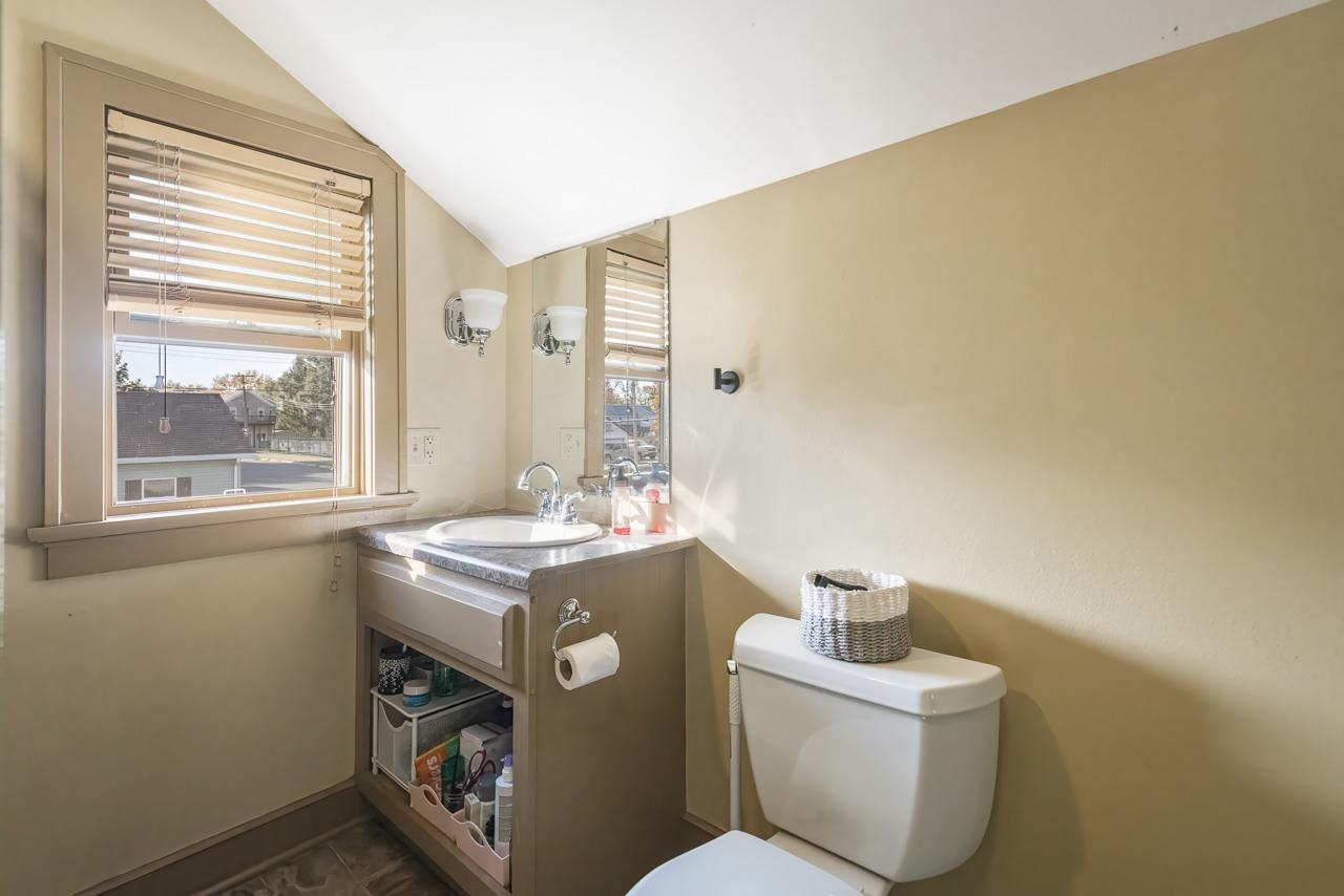 300 Washington Street Ridott, IL 61067 - Photo 29 of 39 a bathroom with a stove a sink and a window