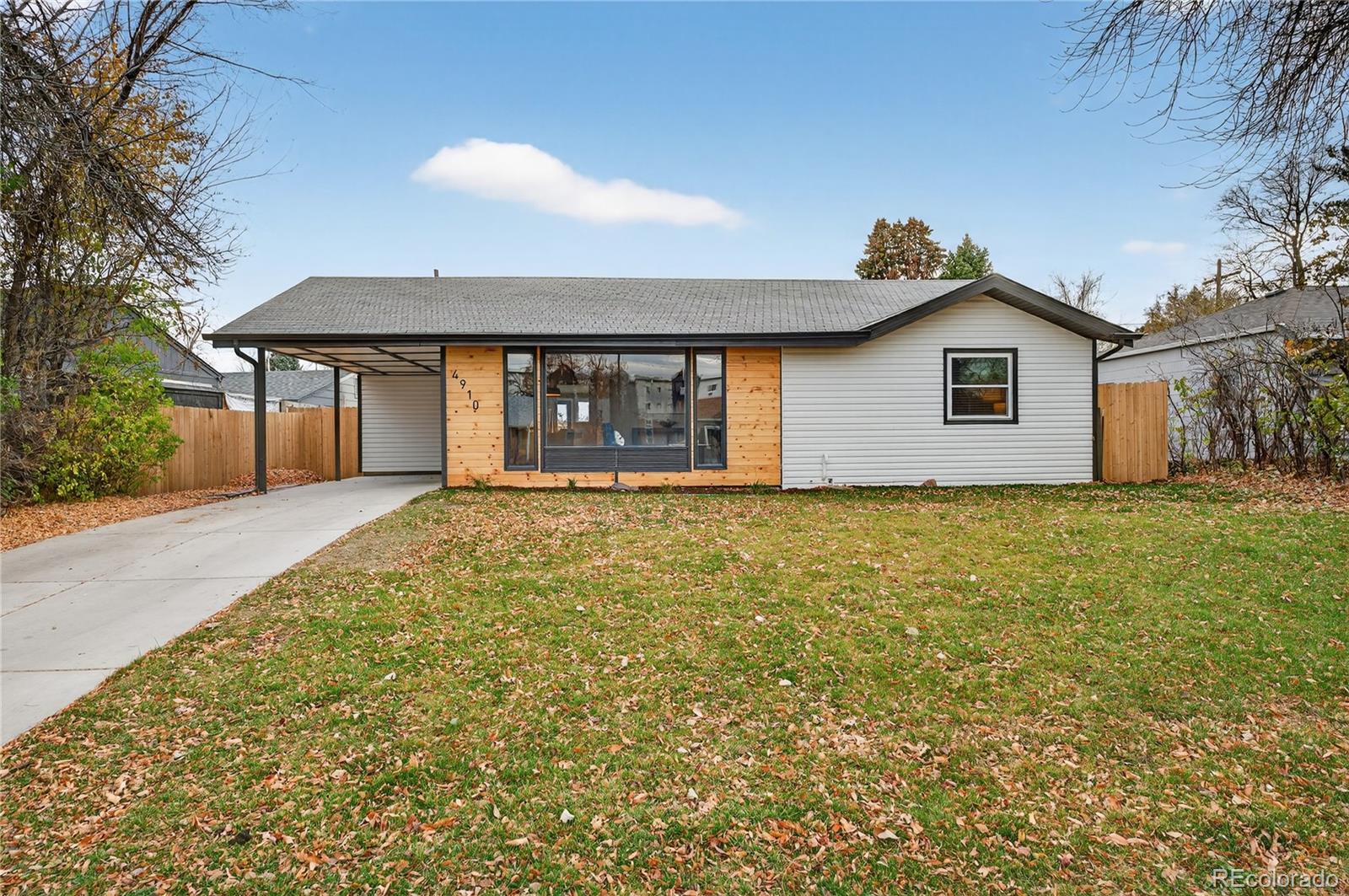 4910 East Missouri Avenue Denver, CO 80246 - Photo 1 of 42 a front view of house with yard and trees