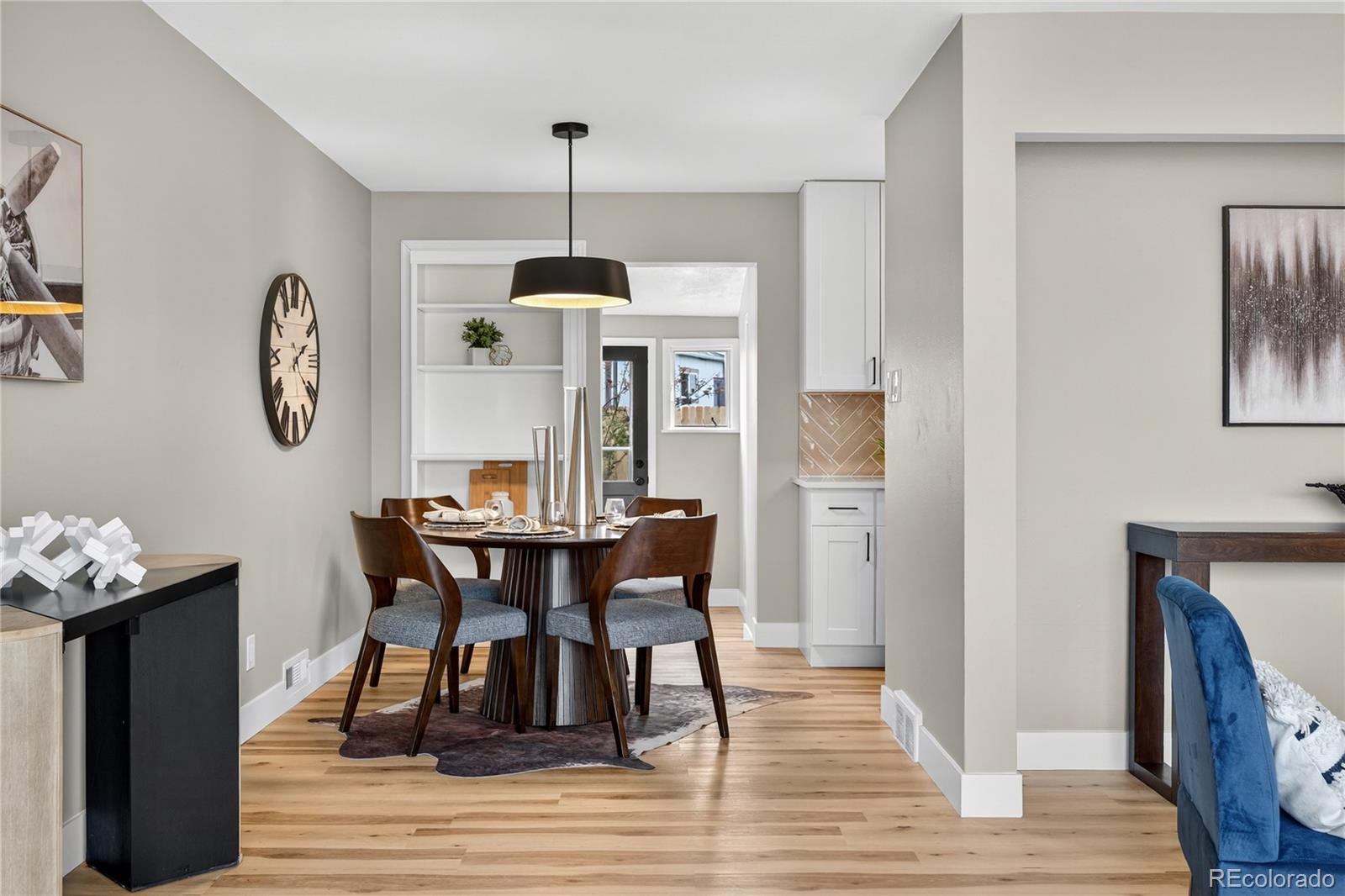 4910 East Missouri Avenue Denver, CO 80246 - Photo 11 of 42 a view of a dining room with furniture window and wooden floor