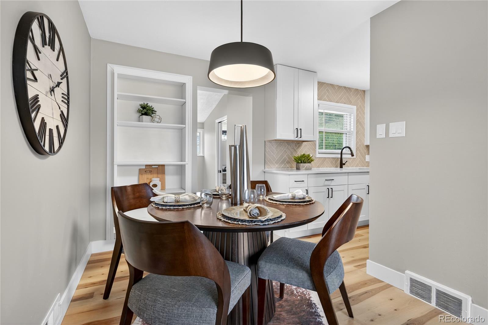4910 East Missouri Avenue Denver, CO 80246 - Photo 12 of 42 a view of a dining room with furniture and wooden floor