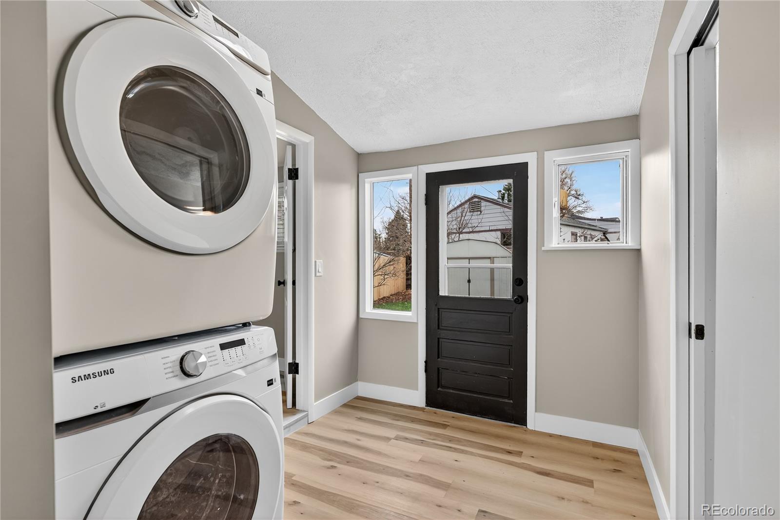 4910 East Missouri Avenue Denver, CO 80246 - Photo 17 of 42 a view of a hallway with washer and dryer
