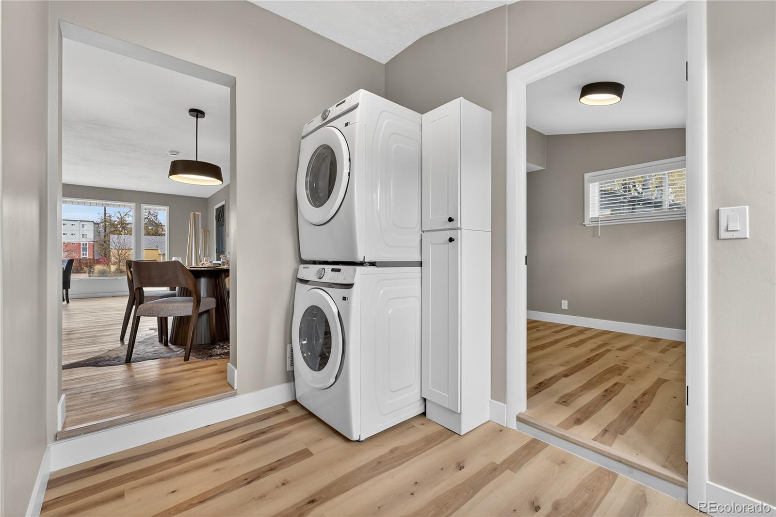 4910 East Missouri Avenue Denver, CO 80246 - Photo 18 of 42 a view of a hallway with washer and dryer