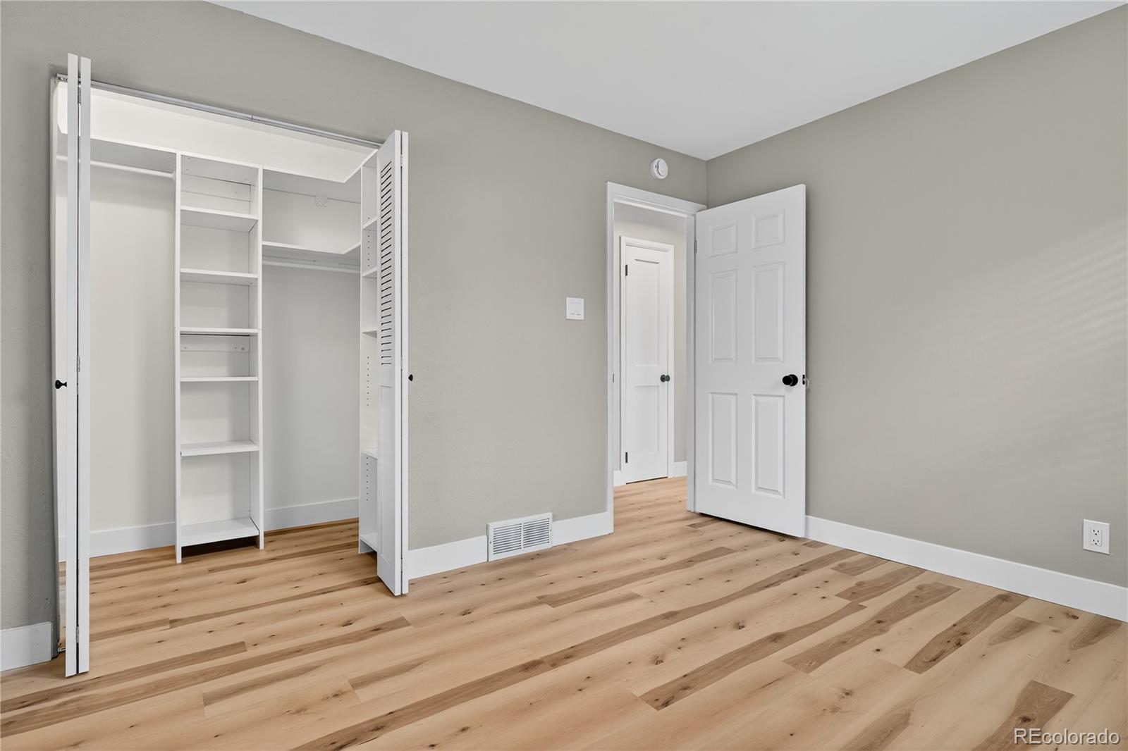 4910 East Missouri Avenue Denver, CO 80246 - Photo 24 of 42 a view of empty room with wooden floor