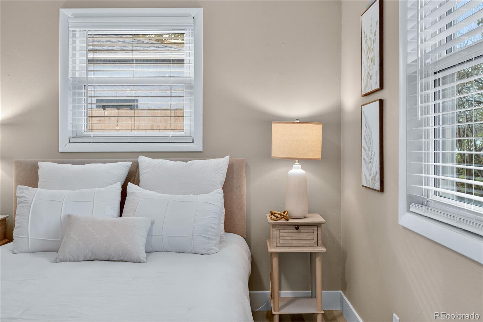 4910 East Missouri Avenue Denver, CO 80246 - Photo 29 of 42 a bedroom with a bed and window