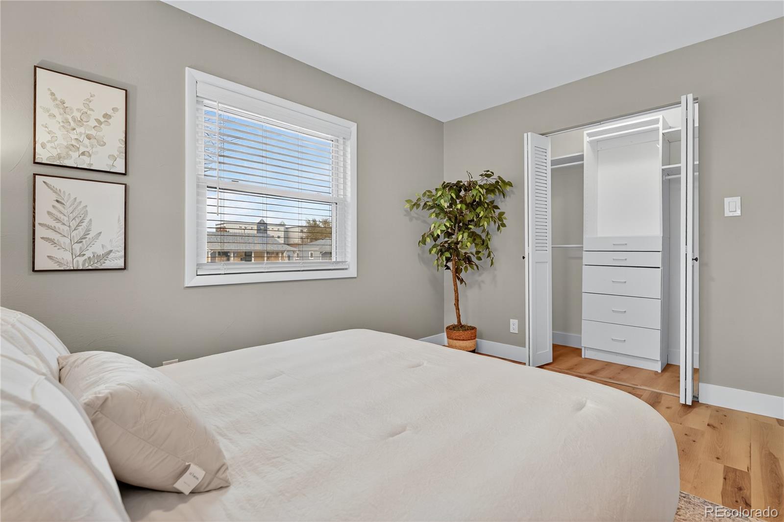 4910 East Missouri Avenue Denver, CO 80246 - Photo 30 of 42 a bedroom with a bed and a window