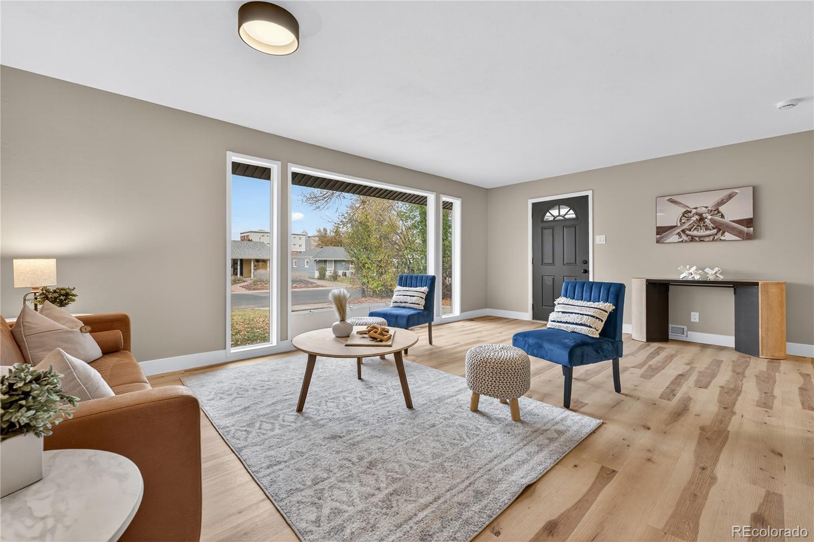 4910 East Missouri Avenue Denver, CO 80246 - Photo 4 of 42 a living room with furniture and a large window