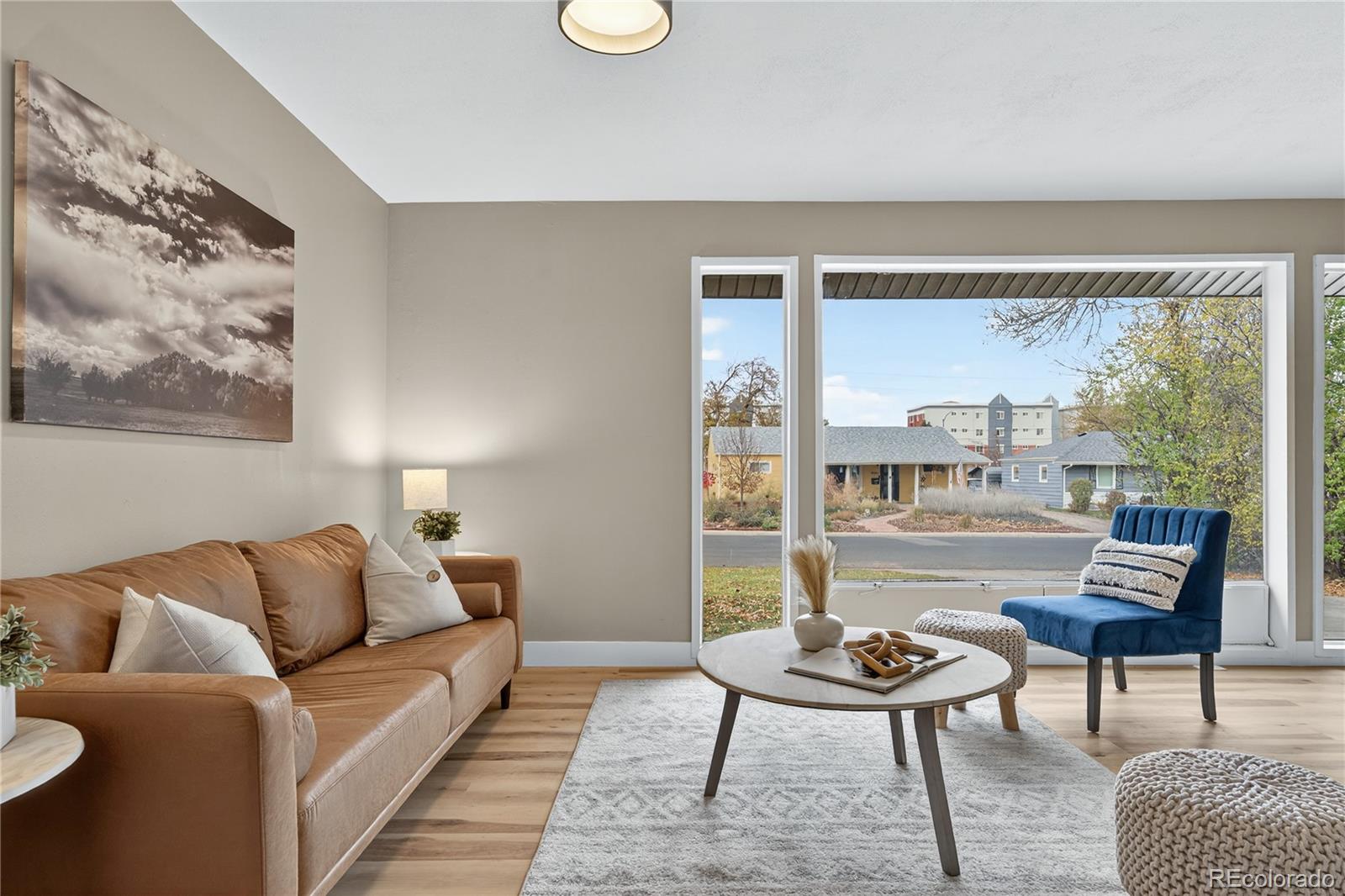 4910 East Missouri Avenue Denver, CO 80246 - Photo 6 of 42 a living room with furniture and a large window