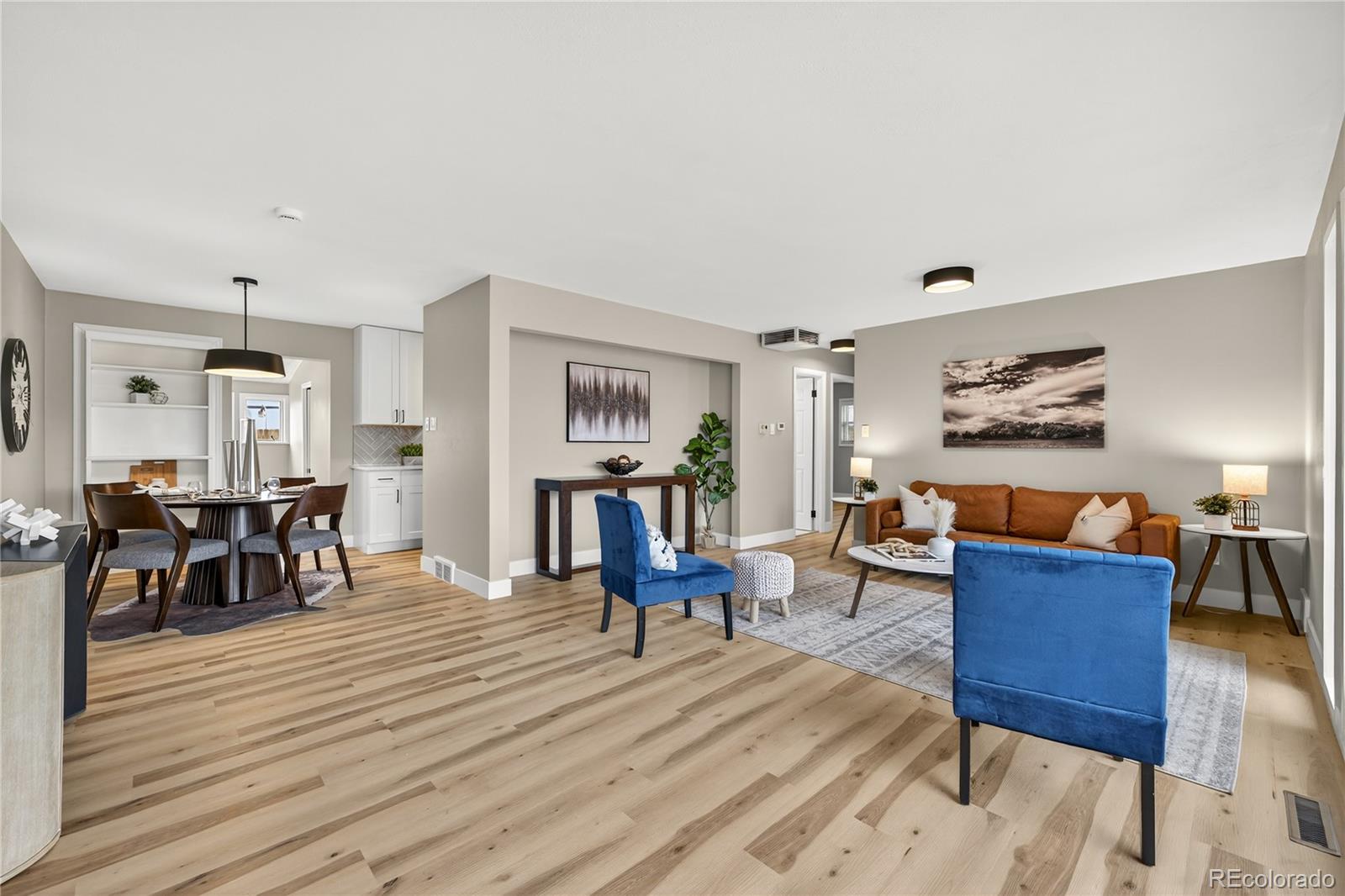 4910 East Missouri Avenue Denver, CO 80246 - Photo 7 of 42 a living room with furniture and wooden floor