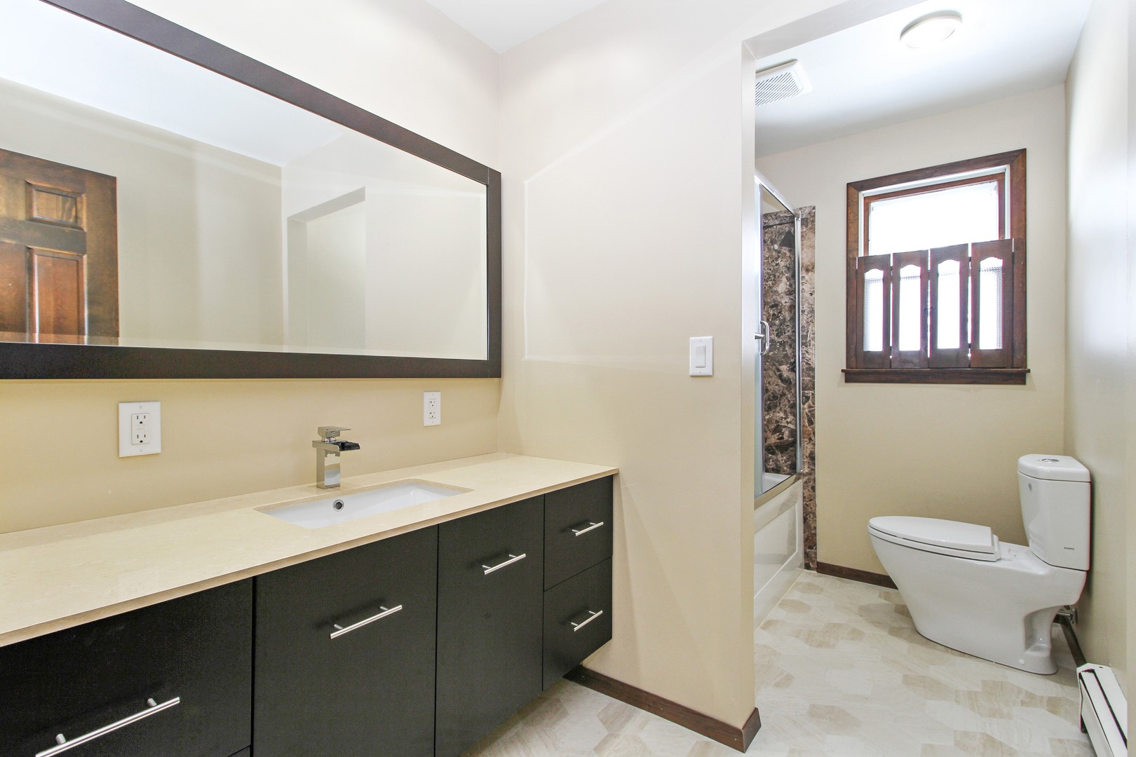 3122 River Road Kankakee, IL 60901 - Photo 10 of 15 a bathroom with a toilet sink and mirror