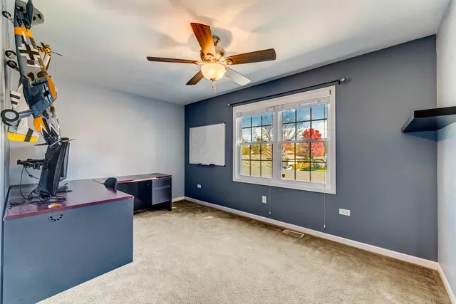 a workspace with furniture and window