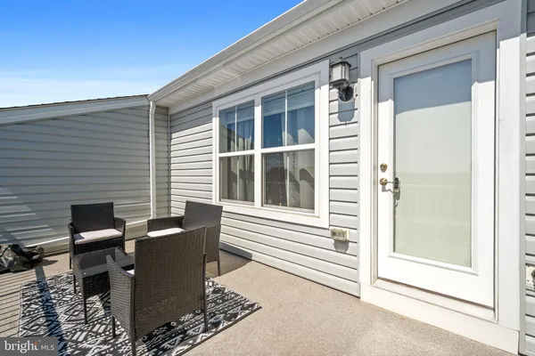 a large kitchen with stainless steel appliances granite countertop a refrigerator and a sink