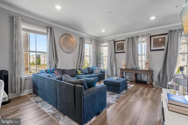 a bedroom with a bed a couch and dresser