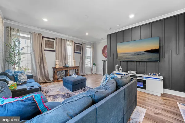 a bathroom with a granite countertop sink a toilet and a mirror