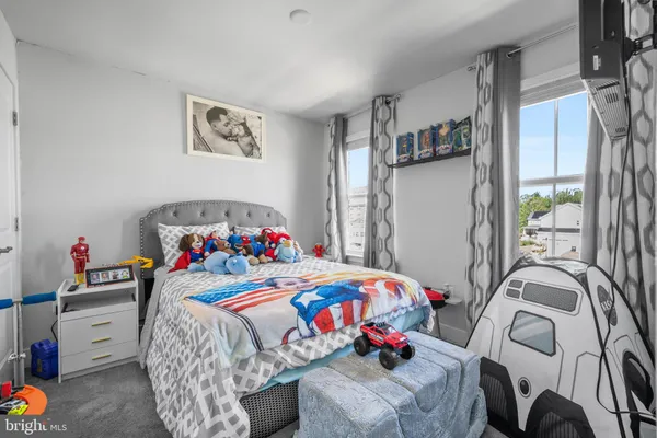 a living room with furniture and a rug