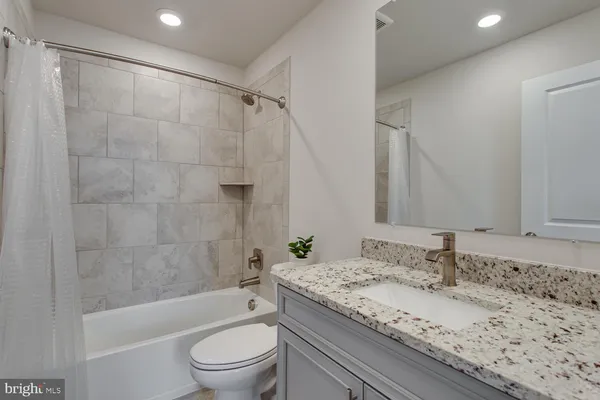 a view of livingroom with hardwood floor and bathroom