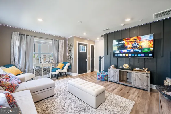 a bathroom with a sink mirror and toilet