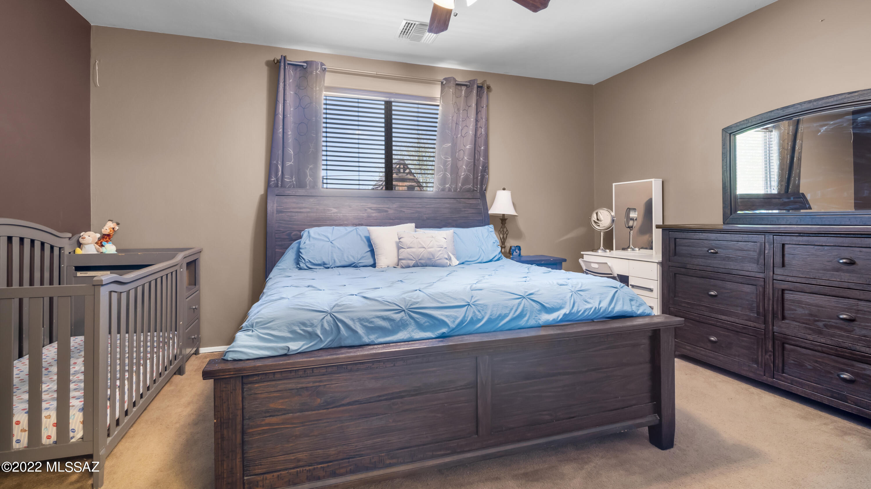 1081 Vista De Los Alamos Rio Rico, AZ 85648 - Photo 20 of 45 a bedroom with a bed and a window