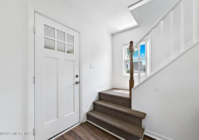 a view of entryway with wooden floor
