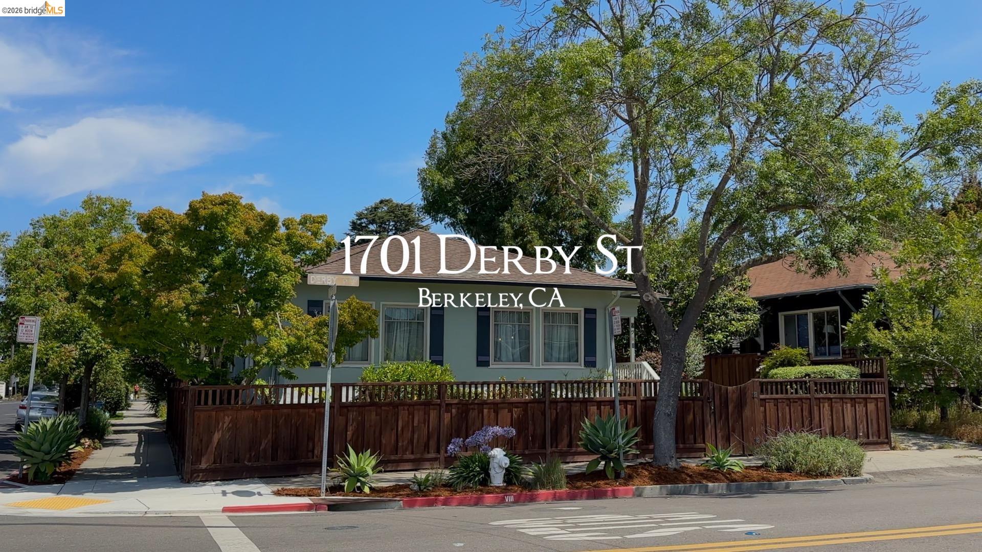1701 Derby Street Berkeley, CA 94703 - Photo 1 of 39 Corner property featuring a light-colored exterior, brown wood fencing, and mature landscaping