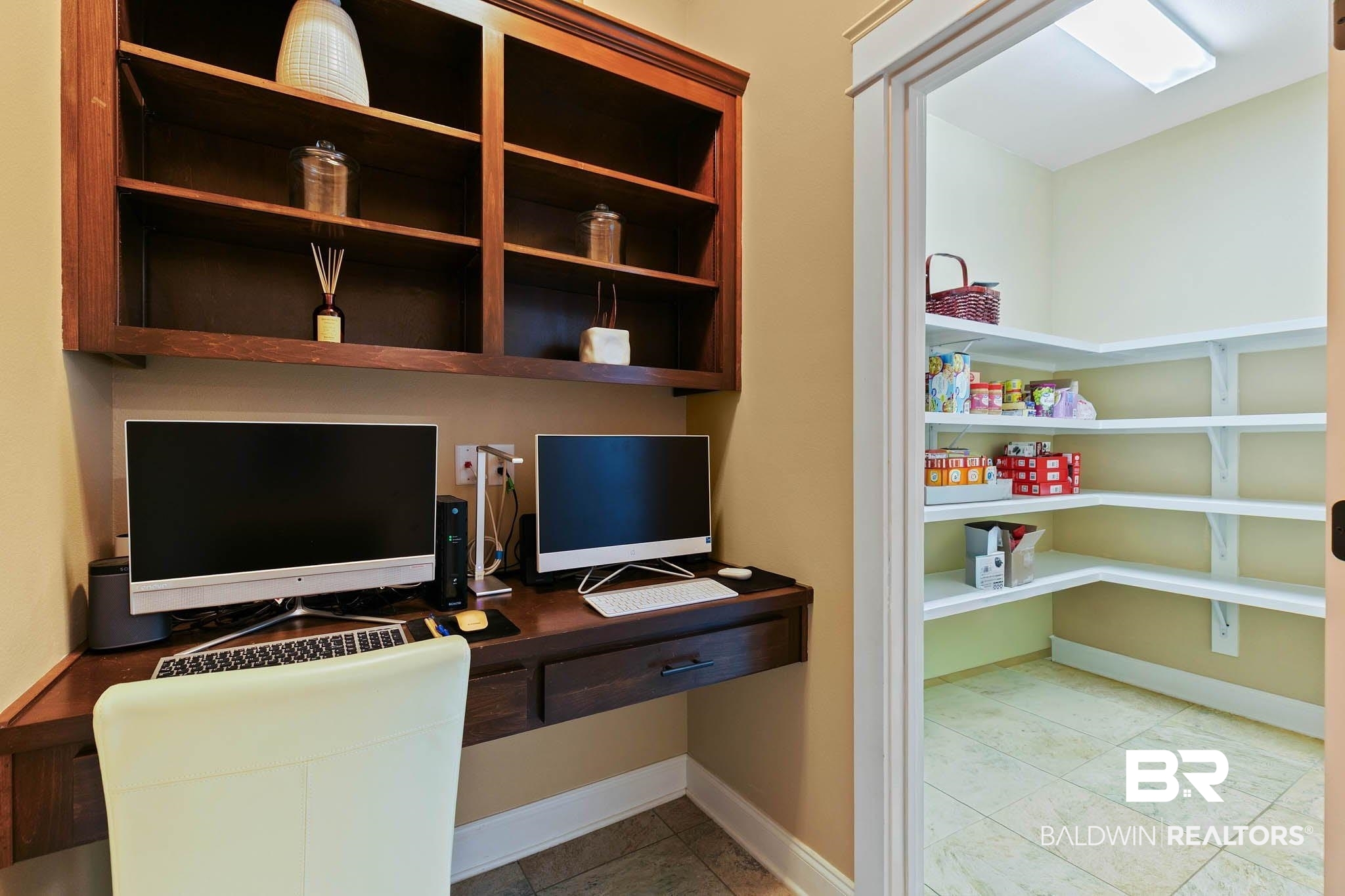 19740 Bunker Loop Fairhope, AL 36532 - Photo 17 of 33 Office with built in desk and light tile patterned flooring