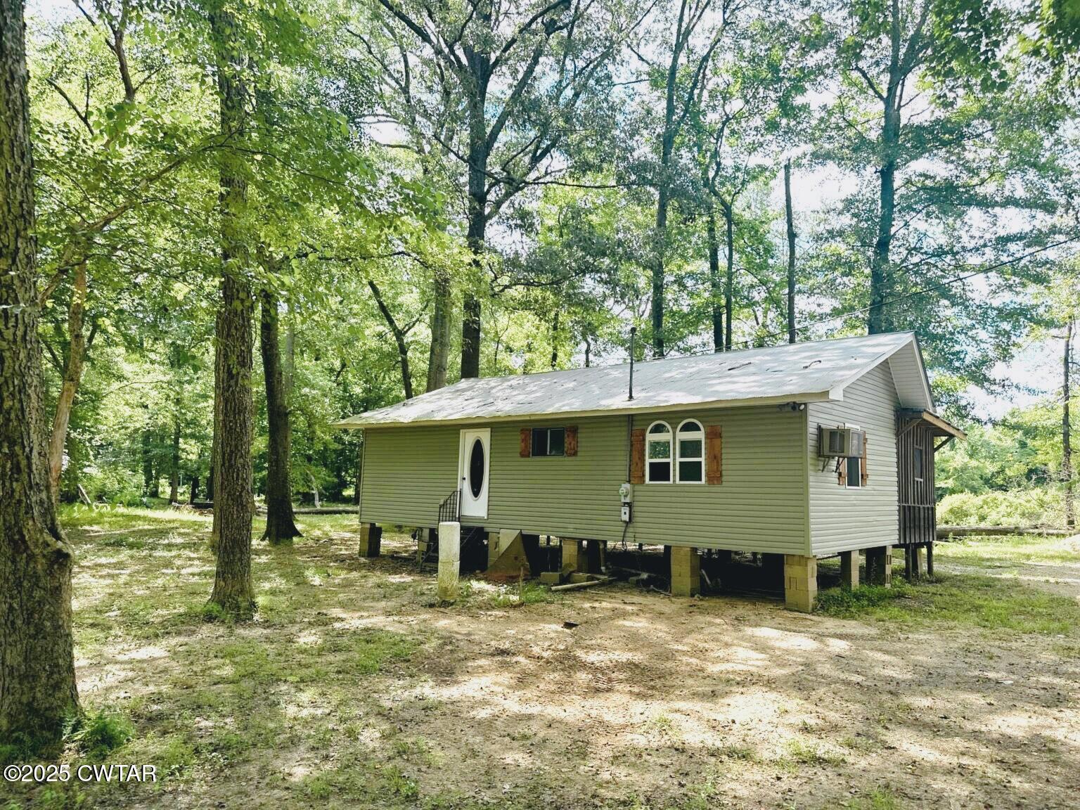 135 River Bend Road Brownsville, TN 38012 - Photo 1 of 14 a view of a house with a yard