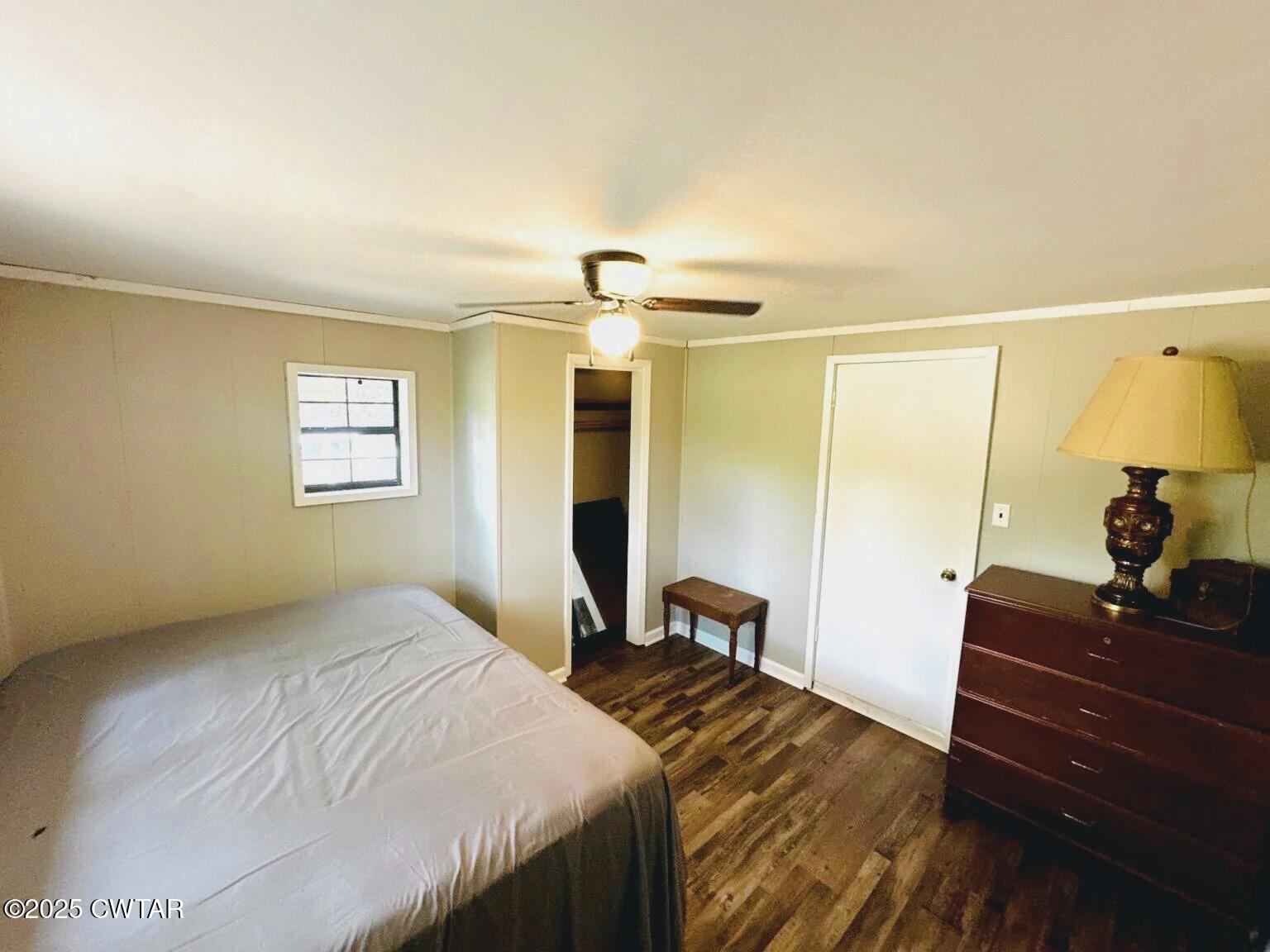 135 River Bend Road Brownsville, TN 38012 - Photo 11 of 14 a bedroom with a bed and a mirror