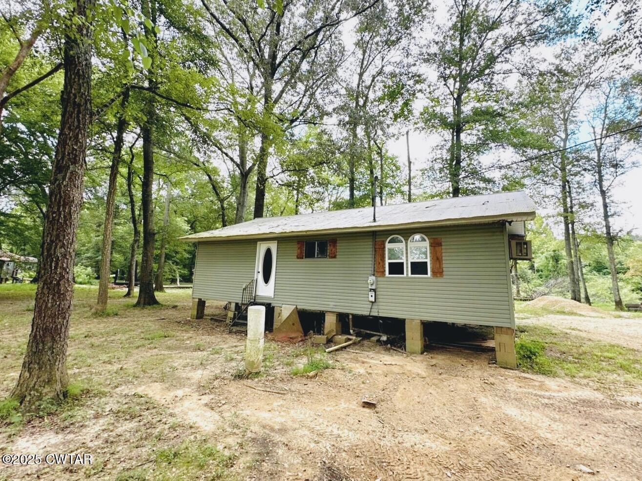 135 River Bend Road Brownsville, TN 38012 - Photo 2 of 14 a view of a house with a yard