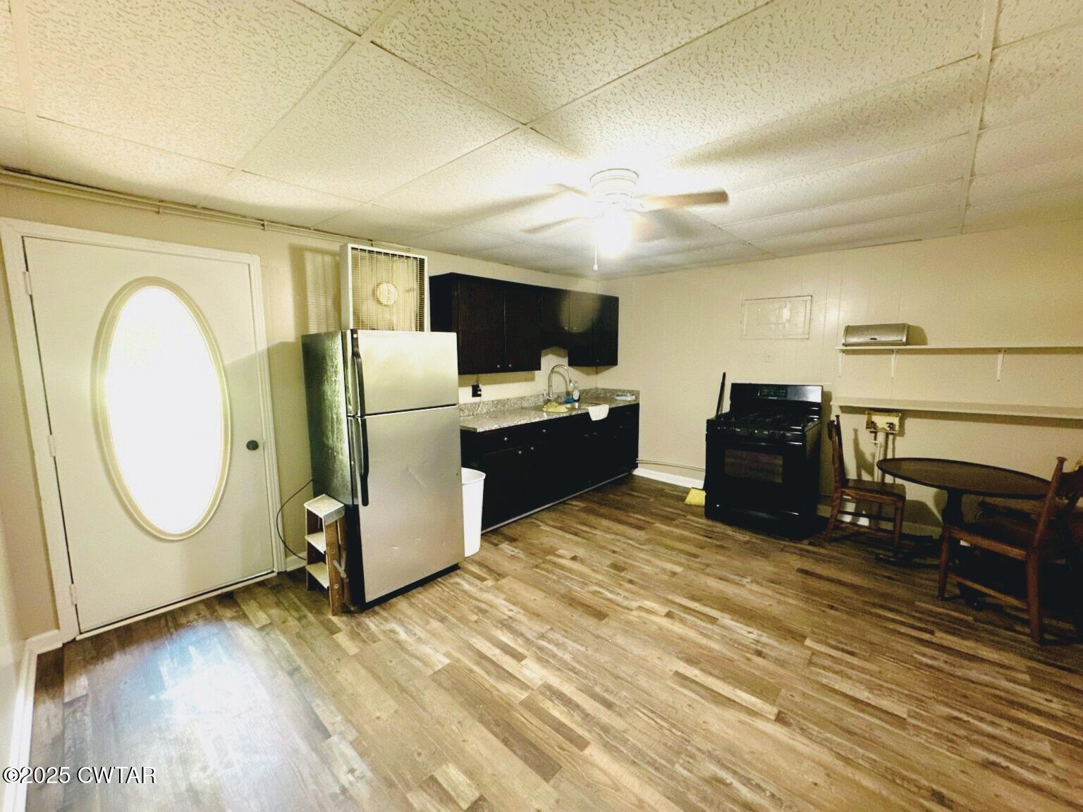 135 River Bend Road Brownsville, TN 38012 - Photo 6 of 14 a living room with furniture a flat screen tv and kitchen view