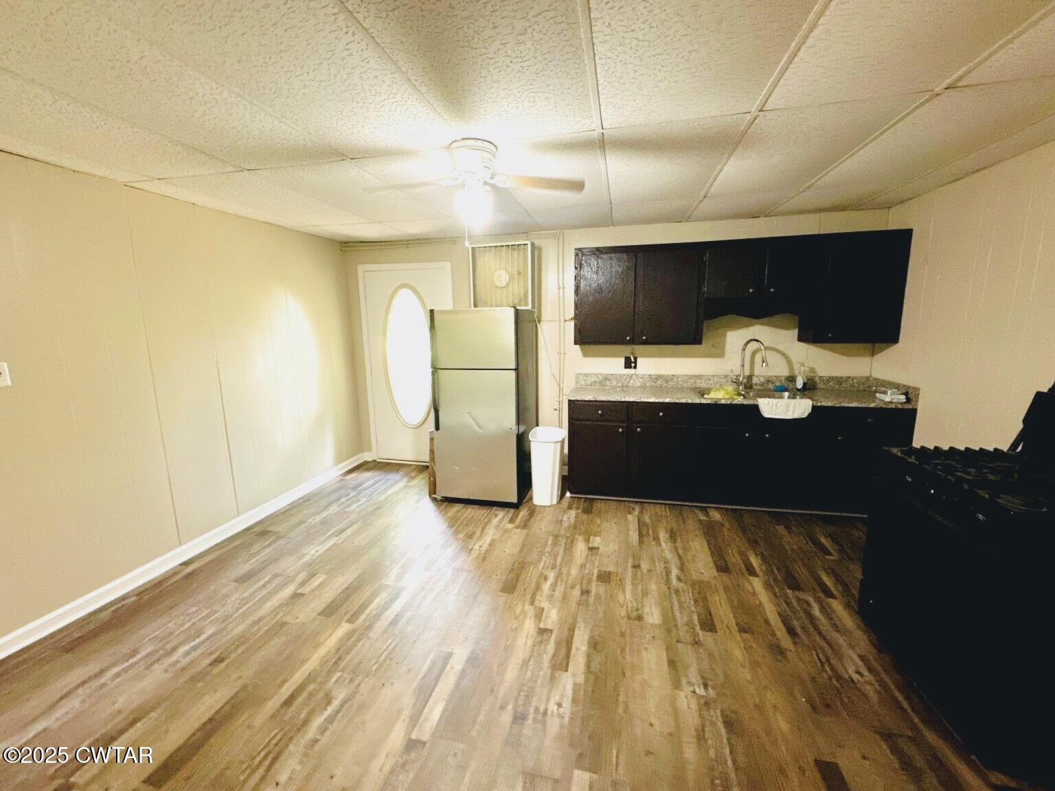 135 River Bend Road Brownsville, TN 38012 - Photo 7 of 14 a view of kitchen with a sink and a refrigerator
