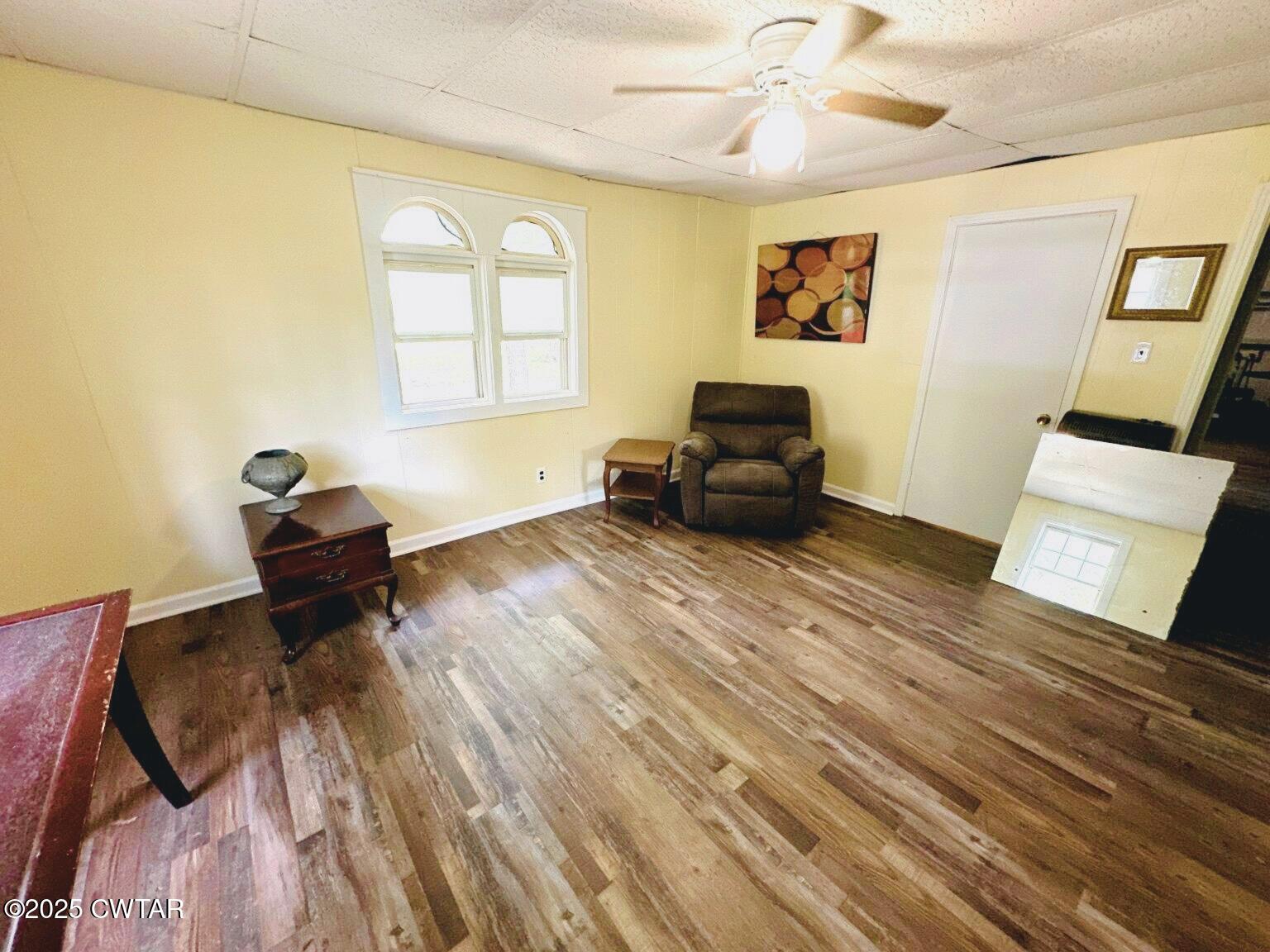 135 River Bend Road Brownsville, TN 38012 - Photo 9 of 14 a living room with a bed furniture and a window