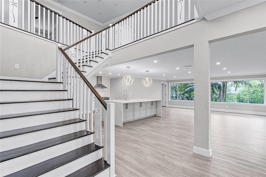 311 East 8th Avenue Windermere, FL 34786 - Photo 15 of 59 a view of staircase with white walls and a window